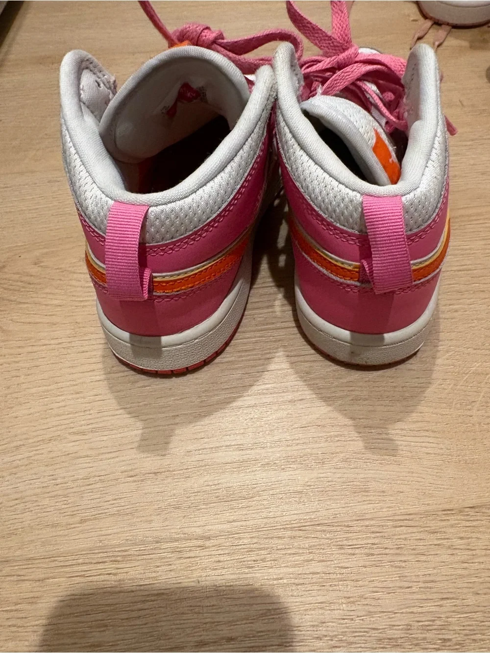 Nike Kids Pink and White High-Top Sneakers with Orange Logo